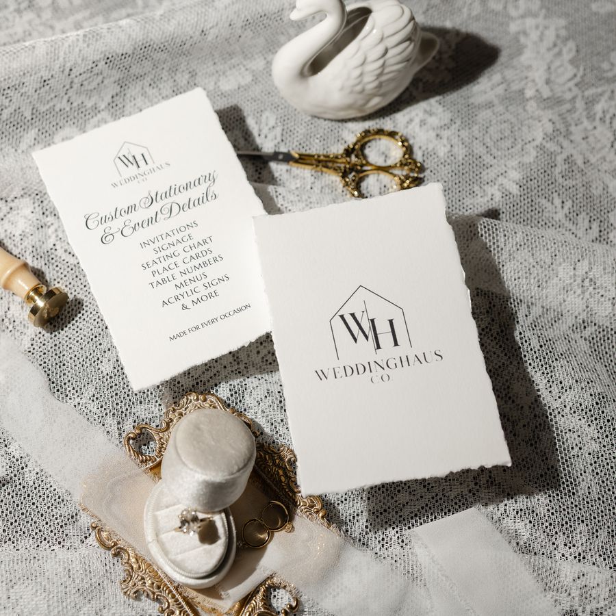 WeddingHaus Co. cards with a wax seal stamp, ring box and silk ribbon