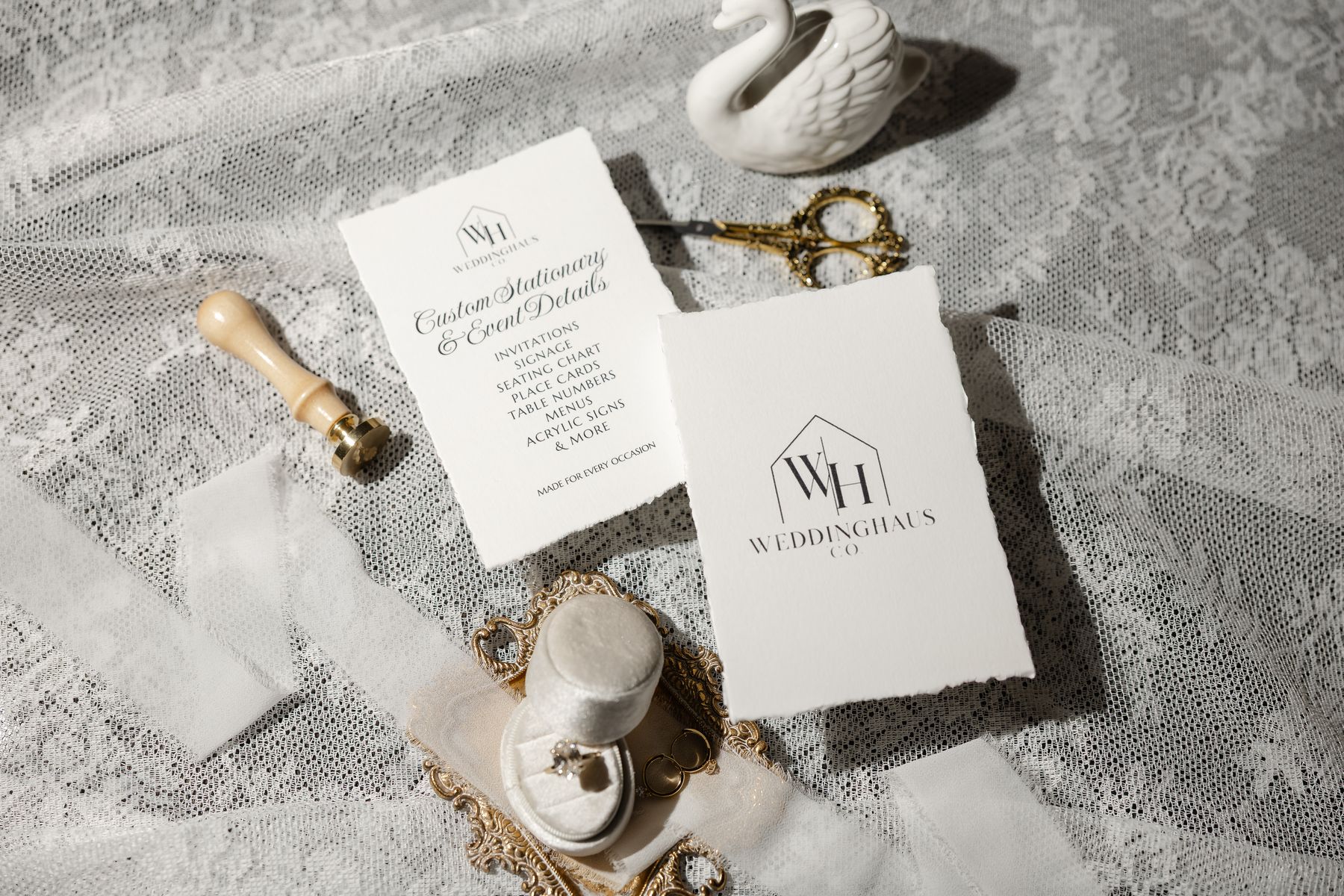 WeddingHaus Co. services card and logo card with a wax seal stamp and ribbon